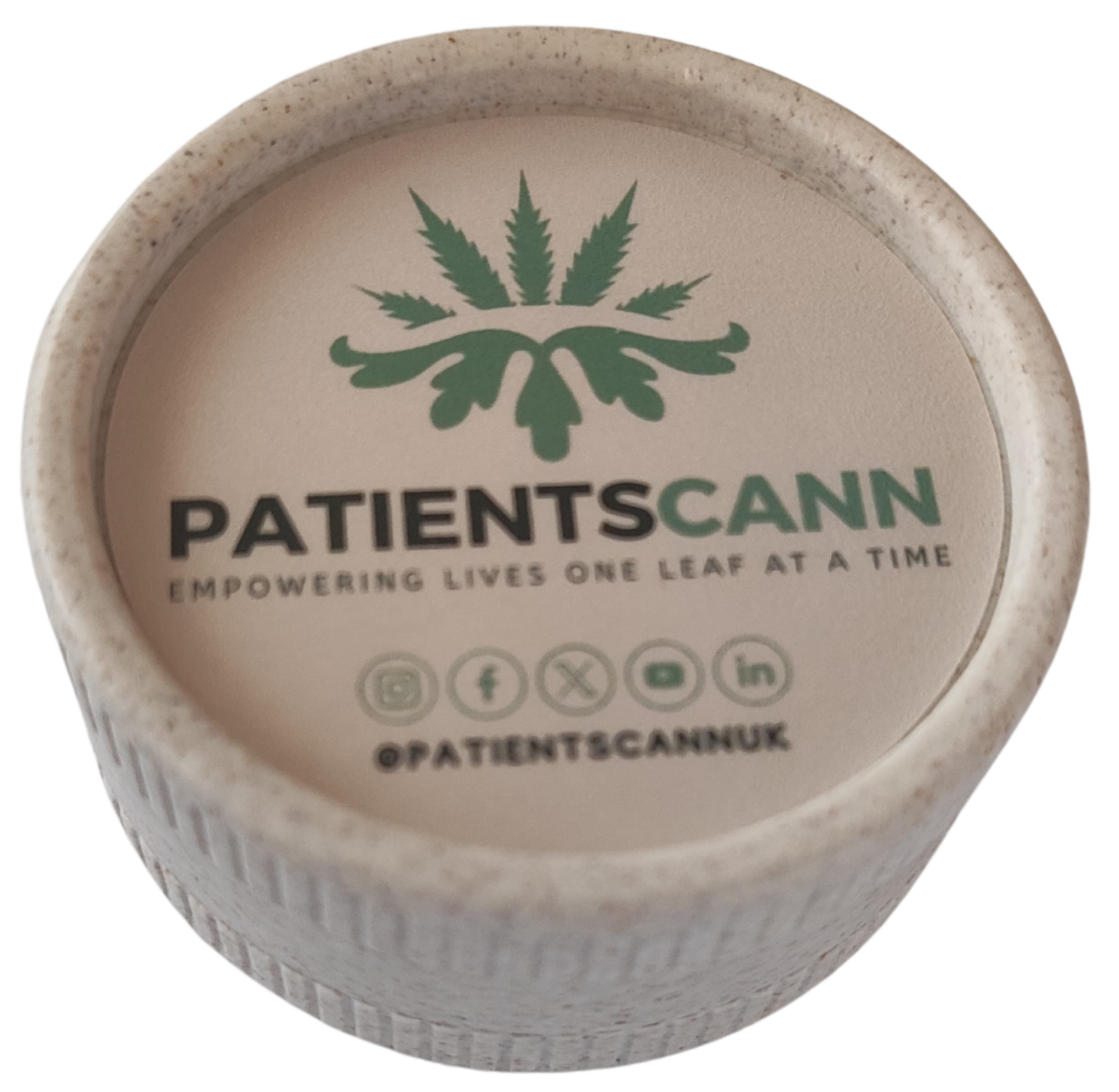 Grinder open showing unground cannabis flower
